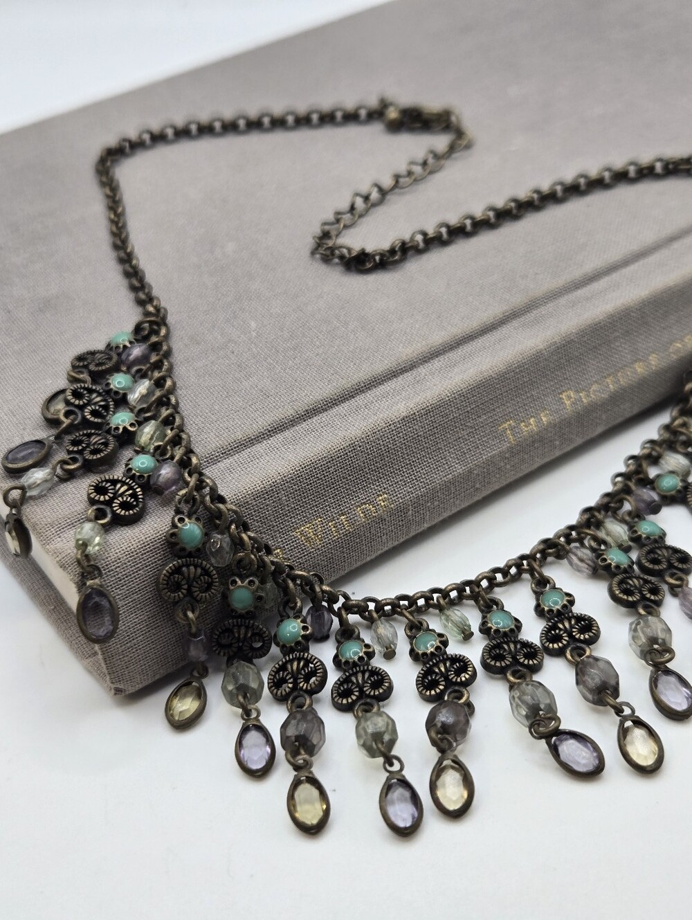 Avon CZ Necklace Victorian Revival whimsical brass bronze Art Deco blue stones